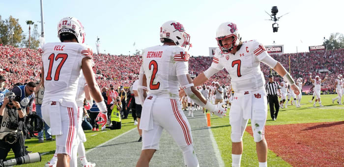 Utah Utes running back Micah Bernard (2) celebrates a touchdown with quarterback Cameron Rising (7) and wide receiver Devaughn Vele (17) during the first quarter of the Rose Bowl in Pasadena, Calif. on Jan. 1, 2022. College Football Rose Bowl.
